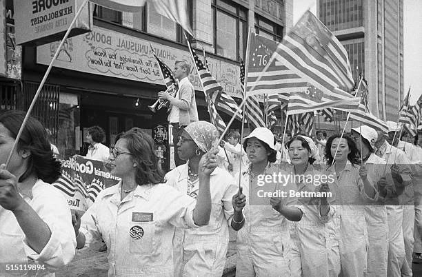 Followers of the Reverend Sun Myung Moon hold street rally in Harlem to focus attention on the Unification Church's free program to be held in Yankee...