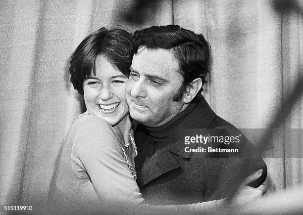 Colorado Springs, Colo.: Dorothy Hamill, of the New York Skating Club hugs her skating coach Carlo Fassi, after she won the senior ladies short...