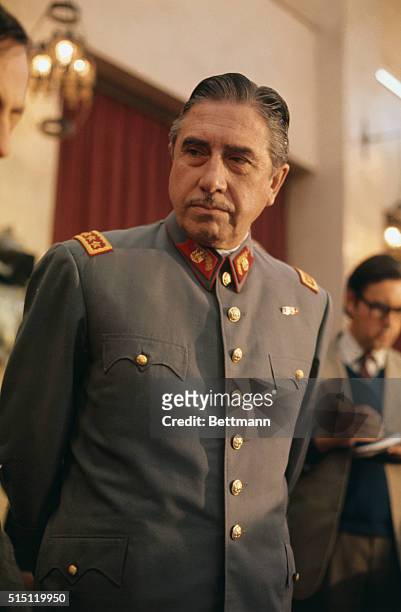 Gen. Augusto Pinochet, head of Chile's ruling military junta, holds a news conference at Santiago's War College September 21. He said that neither...