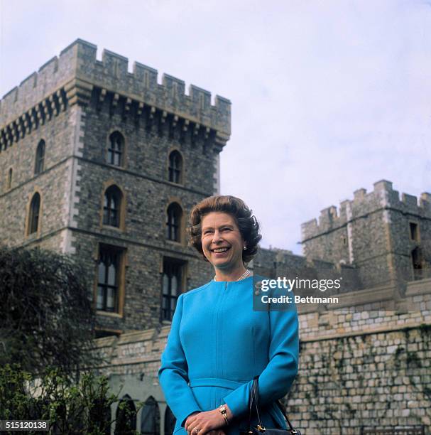 Queen Elizabeth smiles as she poses for official pictures in courtyard of Windsor Castle. The monarch celebrates her 50th birthday 4/21/76.