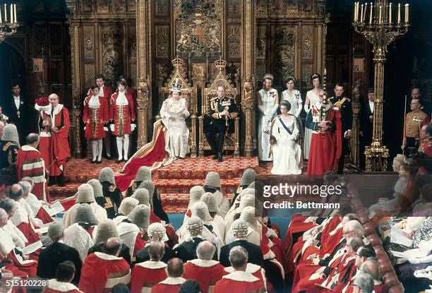 London, England: Queen Elizabeth II delivers her speech during State Opening of Parliament in the House of Lords. Seated to the Queens left, are the...