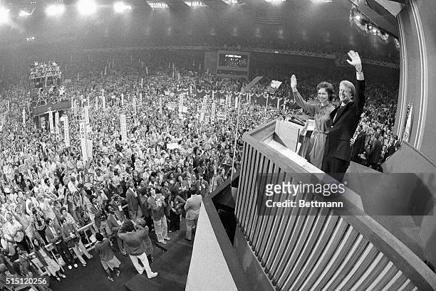 New York, NY- Jimmy Carter and his wife, Rosalynn, wave to the assembled Democratic delegates in Madison Square Garden 7/15 after Carter accepted the...