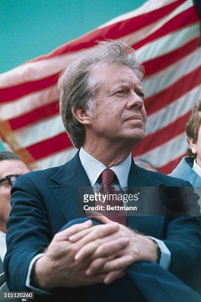 Columbia, S.C.: Democratic candidate Jimmy Carter is in a serious mood as he waits to speak during rally recently in his campaign for the presidency....
