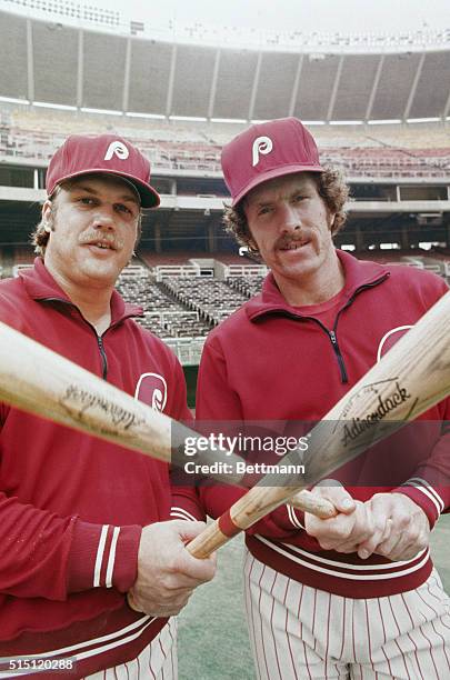 Philadelphia: Greg Luzinski and Mike Schmidt, two of the big guns in the Phillies' attack, ready their artillery for the first game of the N.L....