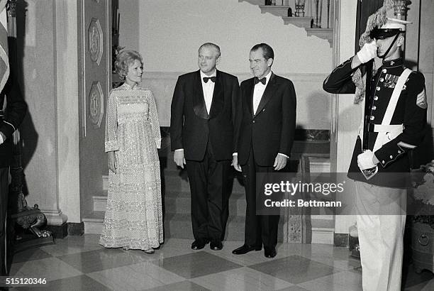 President and Mrs. Richard Nixon pose for photographers with New Zealand Prime Minister Norman Kirk here, at a black tie dinner at the White House.