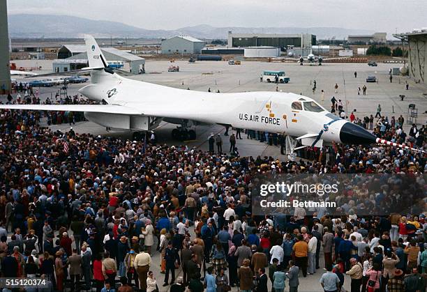 America's newest bomber, the supersonic B-1, is surrounded by workers, guests and dignitaries at rollout ceremonies 10/26. Climaxing 12 years of...