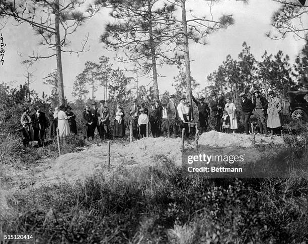 Photo shows three of the six persons killed at Rosewood, Florida, during the race riots there between whites and blacks. Six Negroes were killed and...