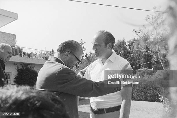 Israeli political party leader Menachim Begin embracing US Ambassador Samuel Lewis after nearly three hours of talking. Begin was elected Prime...