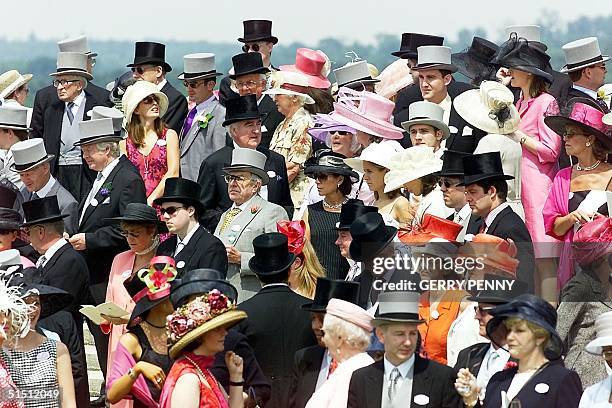 Sea of fine ladies' hats and gentlemen's top hats as crowds await the arrival of Queen Elizabeth II aboard her carriage in the paddock for the forth...