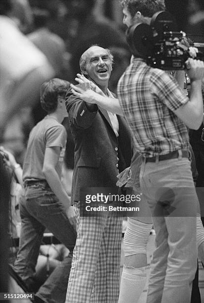 Portland Trailblazers' coach, Jack Ramsay is all smiles as he greets his players at the end of the fifth game in Philadelphia, 6/3. Portland won...