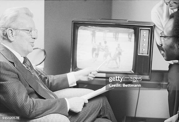 Commissioner Lawrence O'Brien watches video tape replay Dec. 12 showing Los Angeles Lakers' Kermit Washington punching Rudy Tomjanovich of the...
