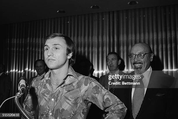 New York, N.Y.: Cosmos President Ahmet Ertegun is all smiles as he introduces the newest member of the team, stat forward Dennis Tueart, formerly...