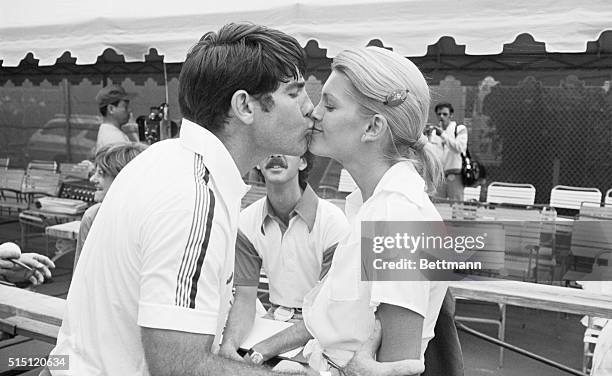 Freeport, Bahamas: Los Angeles Dodgers' first baseman Steve Garvey gets a kiss from his wife, Cindy, after winning an ABC-TV Superstars tennis match...