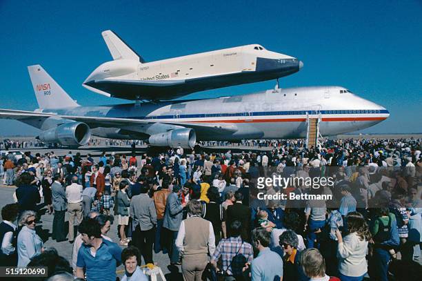 Houston: Crowds surround the Space Shuttle Enterprise and its 747 piggyback carrier after the aircrafts' arrival at Ellington Air Force Base.