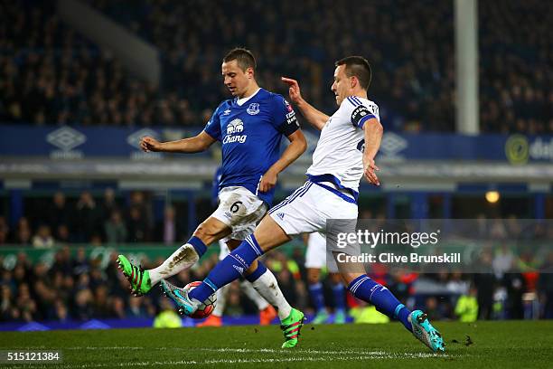 John Terry of Chelsea and Phil Jagielka of Everton compete for the ball during the Emirates FA Cup sixth round match between Everton and Chelsea at...