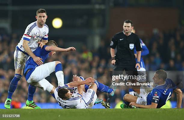 John Terry of Chelsea is challenged by James McCarthy of Everton during the Emirates FA Cup sixth round match between Everton and Chelsea at Goodison...