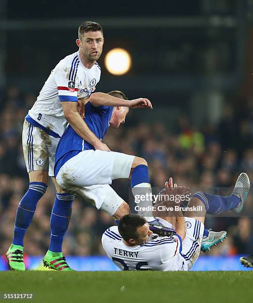 John Terry of Chelsea is challenged by James McCarthy of Everton during the Emirates FA Cup sixth round match between Everton and Chelsea at Goodison...