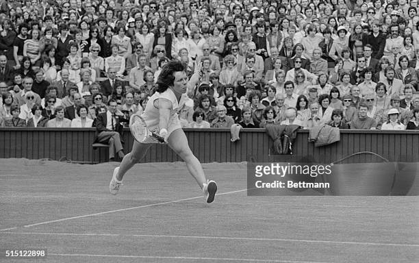An extended Billie Jean King is shown in action against her rival Chris Evert on the Centre Court. Miss Evert won 6-1, 6-2, in the Women's Singles of...