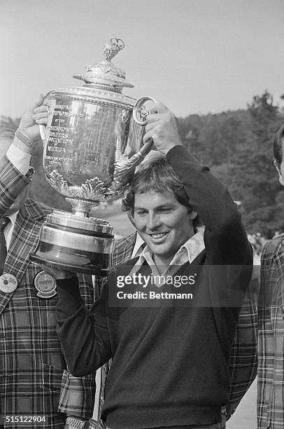 Lanny Wadkins hoists the PGA Championship trophy after he won it be defeating Gene Littler in a sudden death play off, when the two men tied at 6...