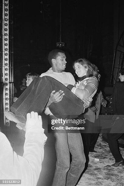 New York: The Disco Scene...Caroline Kennedy doesn't have to take a step while dancing with actor-model Sterling St. Jacques, who holds her in his...