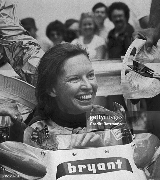 Savoring the "happiest moment" of her life, Janet Guthrie grins from the cockpit of her racer 5/22 after becoming the first woman ever to qualify for...