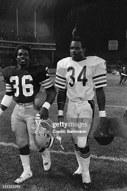 The Payton brothers, Walter and Eddie, enjoy a friendly chat as they leave the field following the exhibition game between the Cleveland Browns and...