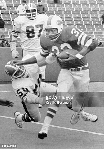 Buffalo's O.J. Simpson sweeps around Atlanta's Greg Brezina for some yardage during Sunday's NFL game in Buffalo. Simpson broke the ten thousand yard...