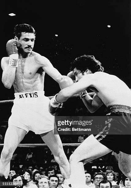 January 20, 1980-Tucson, Arizona: World featherweight champ Alexis Arguello lands a crushing blow to challenger Rueben Castillo's jaw during...