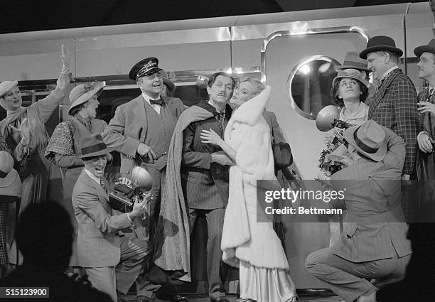 New York: Madeline Kahn, , snuggles up to John Cullum, surrounded by members of the cast, during opening night of the new musical comedy, On the...