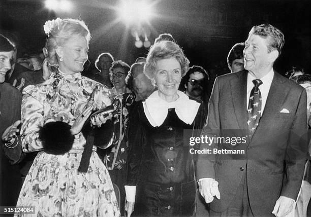 Boston: GOP presidential hopeful Ronald Reagan and wife Nancy are applauded by Mrs. Barbara Sinatra and others attending a concert by Dean Martin and...