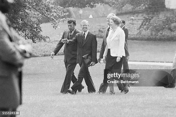 President Carter walks with newly-appointed advisors - Esteban Torres , director of the White House Office of Hispanic Affairs; Sarah Weddington,...