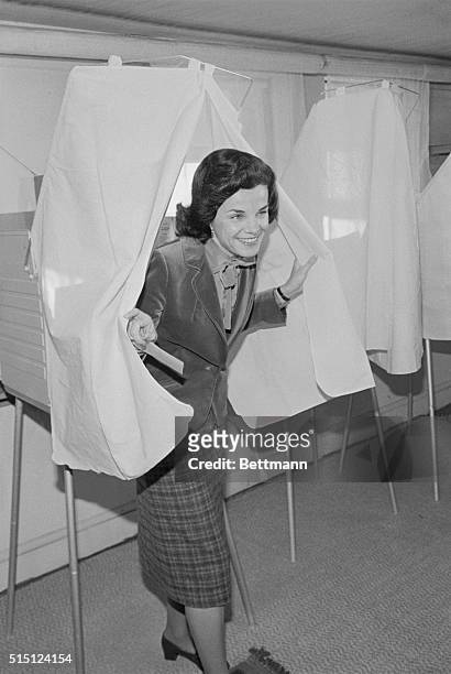 San Francisco: Incumbent Mayor Dianne Feinstein emerges from voting booth after casting her ballot December 11th in a runoff election for mayor of...