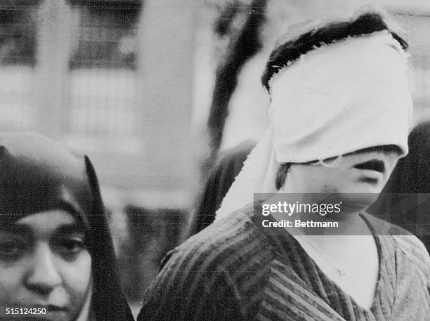 One of the American woman hostages led outside the United States embassy building on the first day of the occupation, 11/4, photographed by an...