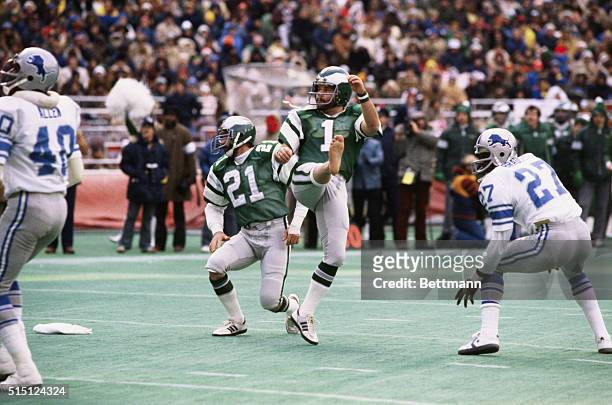Action of Tony Franklin, Philadelphia Eagles, kicking field goal and watching flight of ball in game with Detroit Lions.