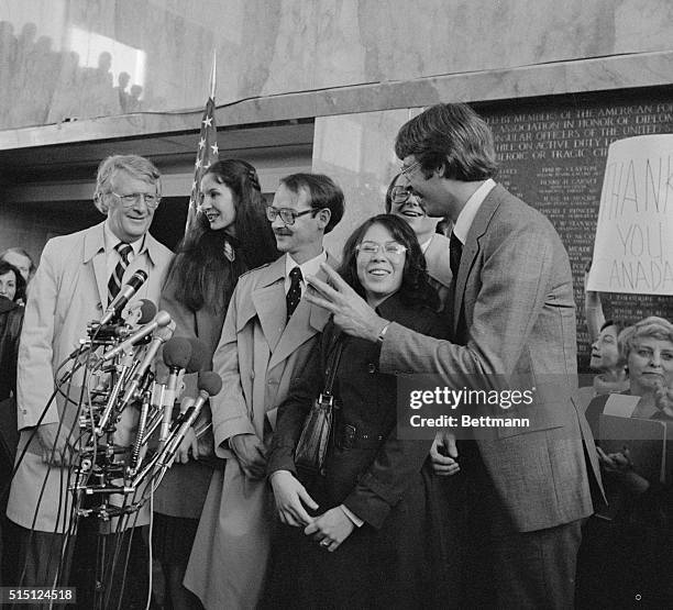 Six Americans receive a warm welcome at a press conference in Washington, DC, after being rescued in Iran by the Canadian embassy. They are Robert...