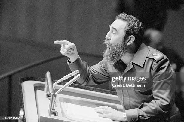 Cuban Premier Fidel Castro gestures with his finger while addressing U.N. General Assembly during his first visit to the United States in 19 years....