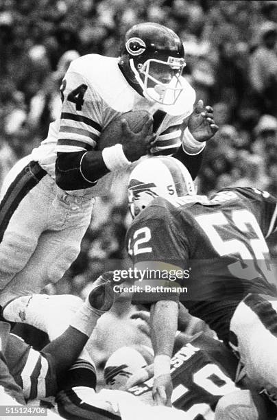 Chicago Bears' running back Walter Payton rockets toward the Buffalo Bills defensive line as he scores Chicago's lone touchdown during the Bears' 7-0...