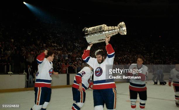 Uniondale, New York: Clark Gillies of the New York Islanders and happy teammates celebrate their Stanley Cup victory over the Philadelphia Flyers,...