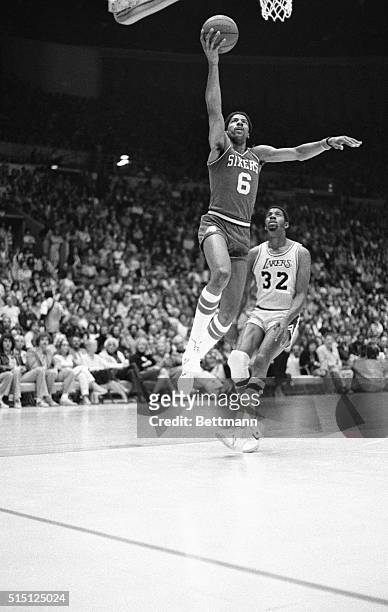 Philadelphia 76ers' Julius Erving goes up for a layup during an NBA Championship game against the Los Angeles Lakers
