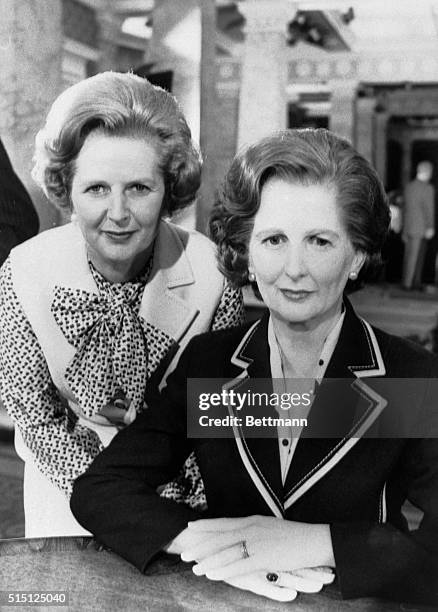 London, England- Prime Minister, Mrs. Margaret Thatcher, poses with a wax portrait of herself in Madam Tussaud's collection. Her likeness, by...