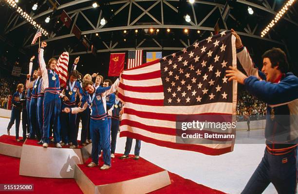 The American hockey team celebrates its gold medal victory over Finland with an impromptu display during presentation ceremonies at the Olympic...