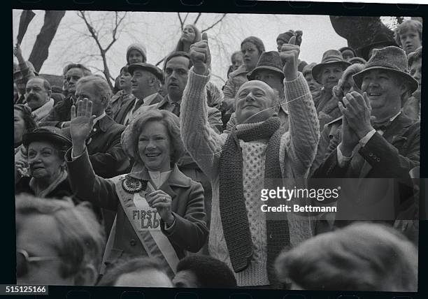 New York City's Ed Koch really gets into the spirit of the St. Patrick's Day Parade here, as he cheers form the reviewing stand. With him are First...