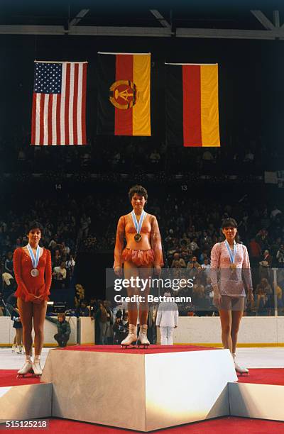 Winners of Olympics medals in the women's figure skating competition pose with their medals at presentation ceremonies 2/23, from left; Linda...