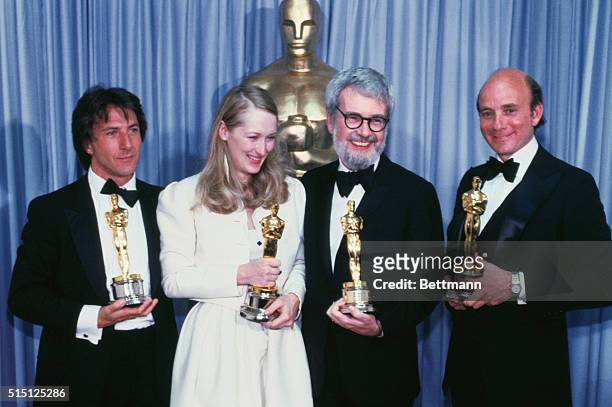 Hollywood: The big winners of the movie, Kramer vs. Kramer, hold up four of the Oscars won by the film at the 52nd Annual Award presentations at the...