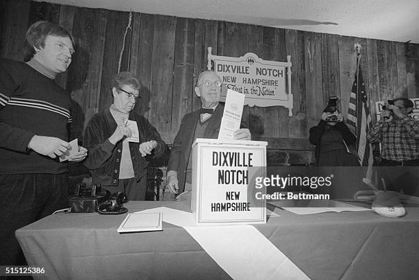 Neil Tillotson, Dixville Notch town moderator, prepares to cast the first primary vote in the Nation as Mrs. Cora Whitton, Supervisor of the...