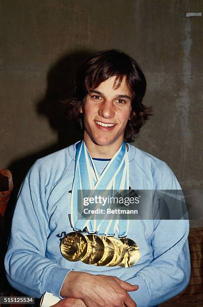 American speedskating star Eric Heiden poses with his record five gold medals 2/24. Heiden swept every men's Olympic speedskating event.