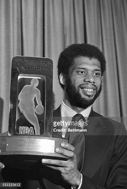 Los Angeles, California: Kareem Abdul-Jabbar of the world champion Los Angeles Lakers holds up his sixth MVP trophy he received from the NBA during...