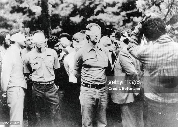 Tehran, Iran. This photo taken on the first day of occupation of the U.S. Embassy in Tehran shows American hostages being paraded by their militant...