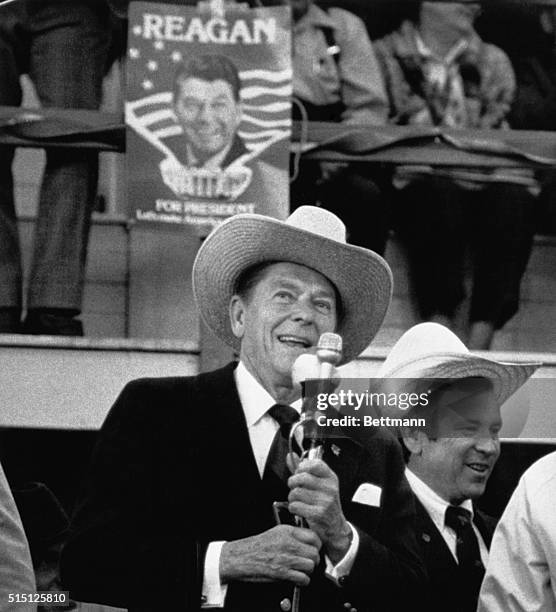 New Holland, Pennsylvania: On the final day of campaigning before the crucial Pennsylvania primary, presidential candidate Ronald Reagan dons a...