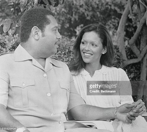 Port-Au-Prince, Haiti: Michelle Bennette smiles at her husband-to-be, President Jean-Claude Duvalier, at a press conference today, May 25. The couple...